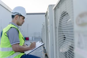 A man checking the ventilator