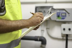 man checking facility management documents