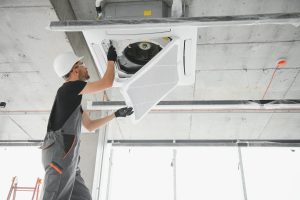 Technician conducts a commercial HVAC inspection