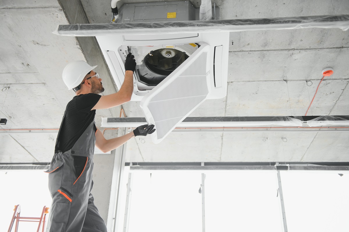 Technician conducts a commercial HVAC inspection