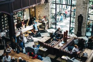 a busy cafe or bar with lots of people in