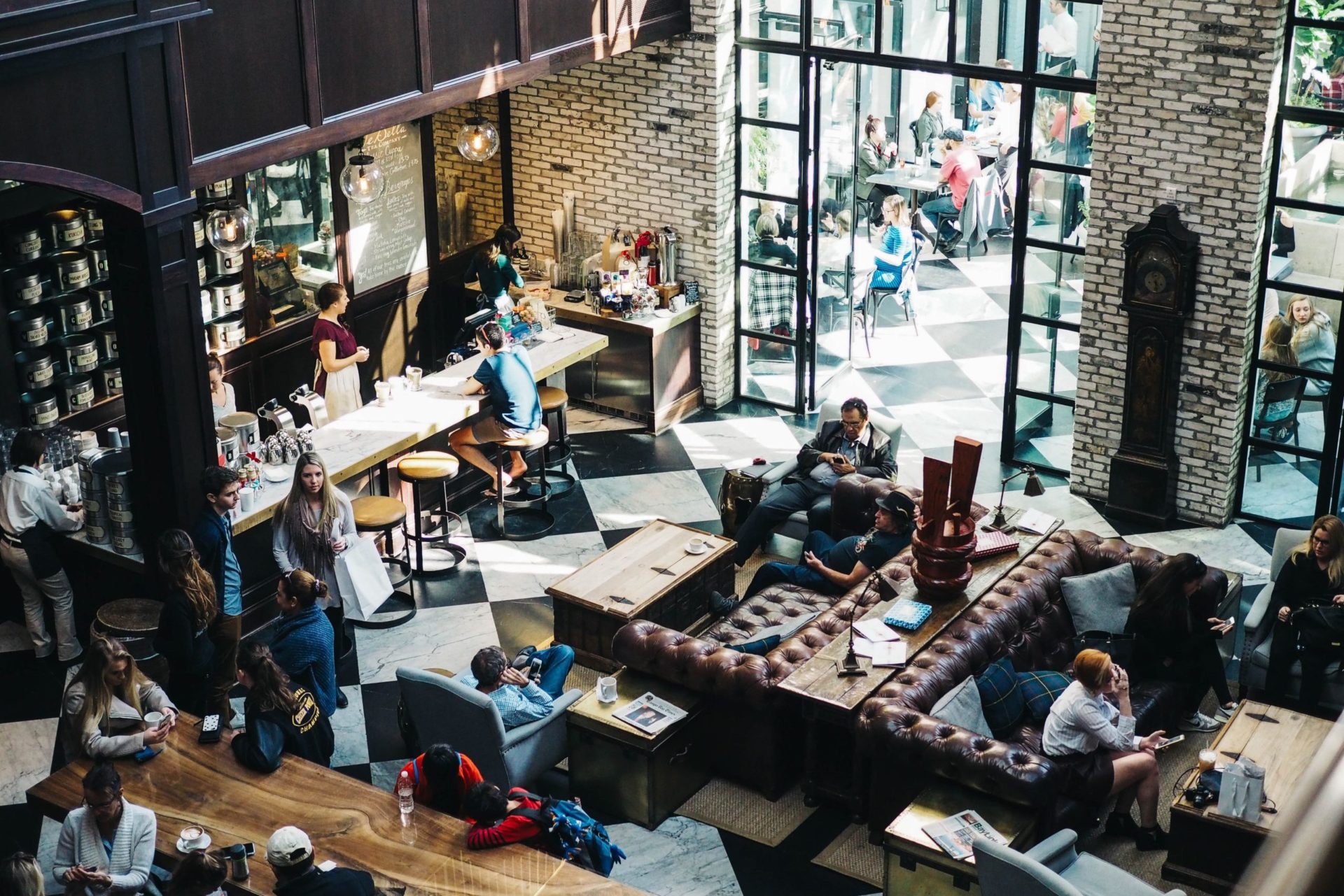 a busy cafe or bar with lots of people in